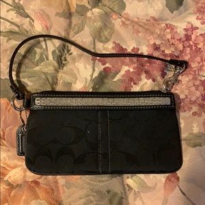 Coach black wristlet with beaded details on top!